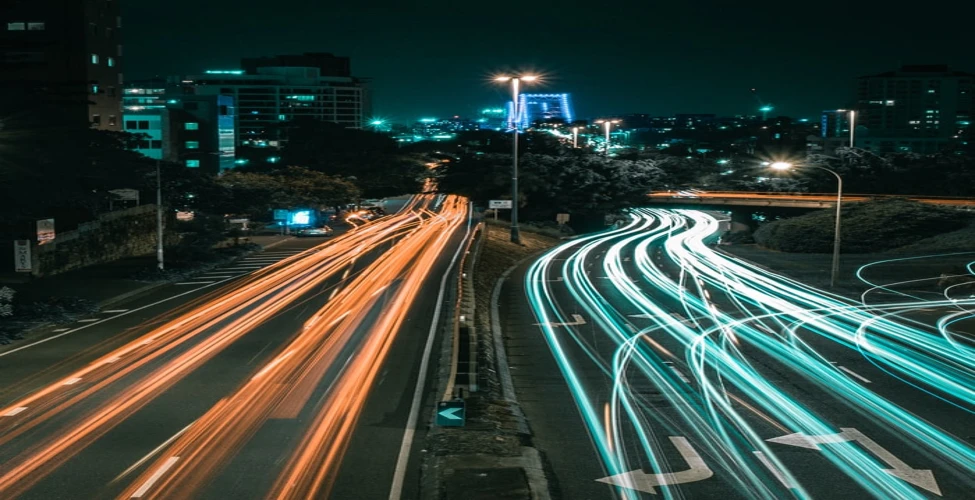 A busy road with a lot of cars andlights