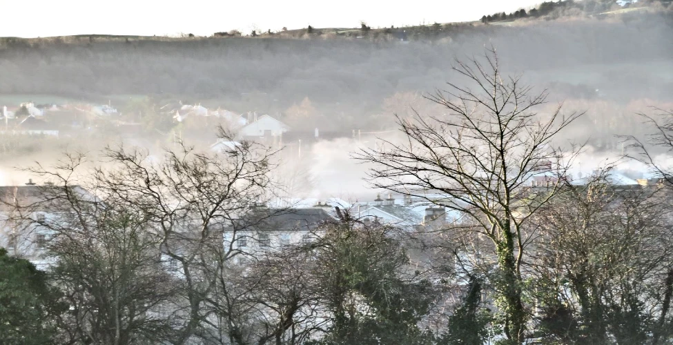 Smog in the air surrounding a house